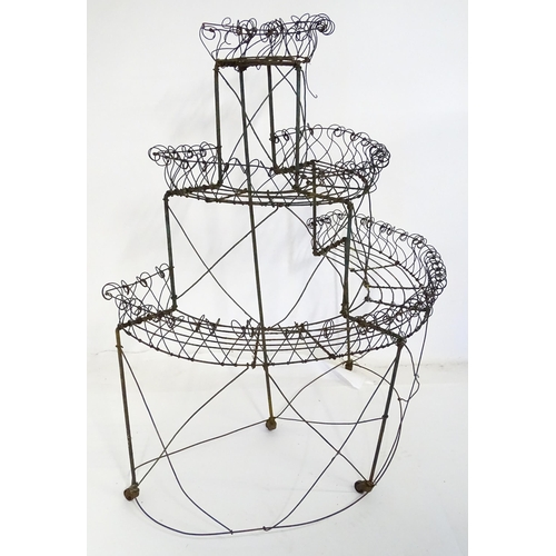 819 - Garden / Architectural : a Regency style wirework flower rack, of demi lune form in three tiers supp... 