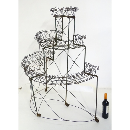 819 - Garden / Architectural : a Regency style wirework flower rack, of demi lune form in three tiers supp... 