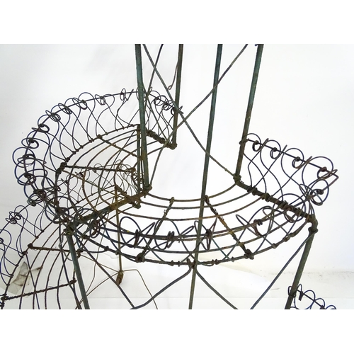 819 - Garden / Architectural : a Regency style wirework flower rack, of demi lune form in three tiers supp... 