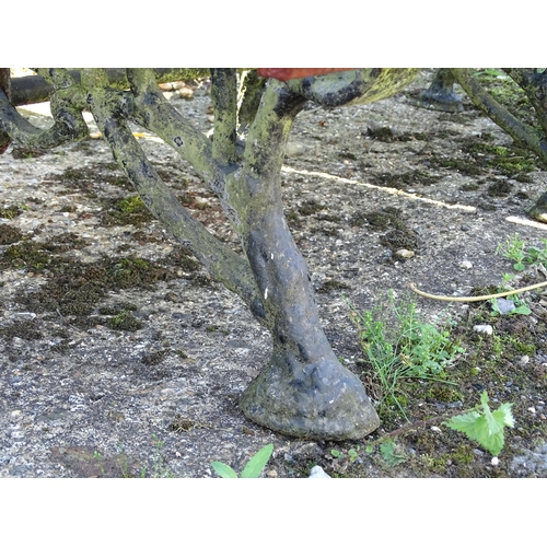 825 - Garden / Architectural: a 19thC cast iron garden bench, the three supports / ends formed as branches... 