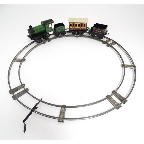 855 - Toys - Railway / Train Interest : A Bing tinplate clockwork train set comprising a locomotive, two t... 