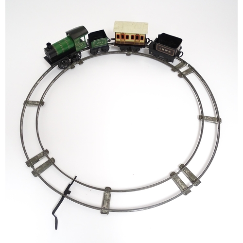 855 - Toys - Railway / Train Interest : A Bing tinplate clockwork train set comprising a locomotive, two t... 