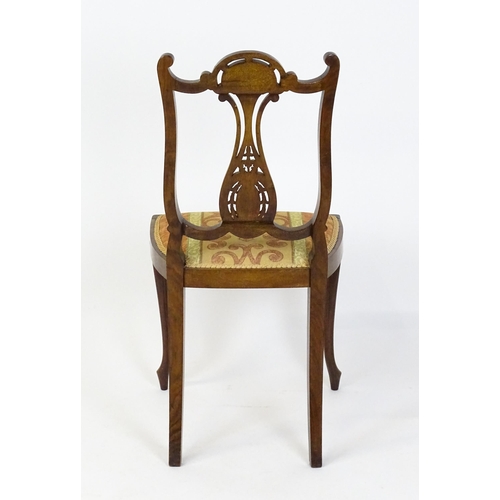 1625 - An Edwardian mahogany side chair with satinwood and bone inlay above a central splat with a carved f... 