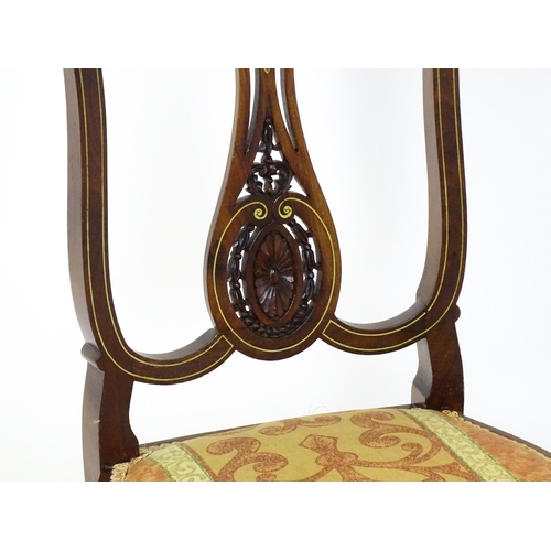 1625 - An Edwardian mahogany side chair with satinwood and bone inlay above a central splat with a carved f... 