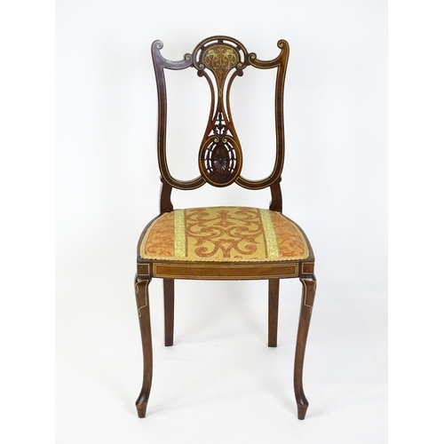 1625 - An Edwardian mahogany side chair with satinwood and bone inlay above a central splat with a carved f... 