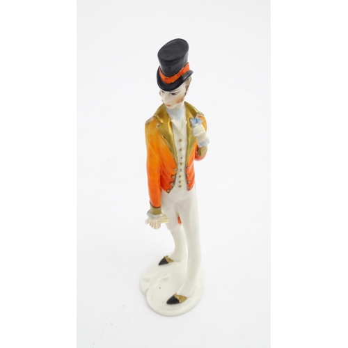 137 - A 20thC Italian Silvio Righetto figure modelled as a gentleman wearing a frock coat and a top hat. M... 