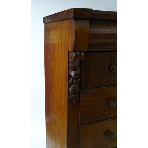 1618 - A Victorian North Country chest of drawers of large proportions, the chest having a cushion drawer a... 