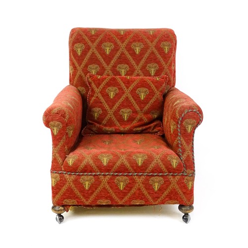 1583 - An early / mid 20thC armchair with scrolled arms and raised on squat bun front feet. 33