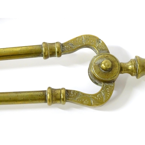 1657 - Four 19thC brass fire tools, comprising shovel, poker, tongs and hook. The largest approx 25