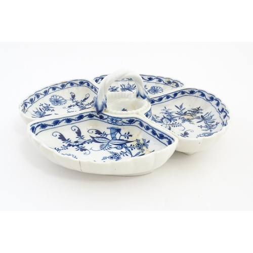 16 - A Continental blue and white hors d'oeuvre dish decorated in the Onion pattern with four sections an... 