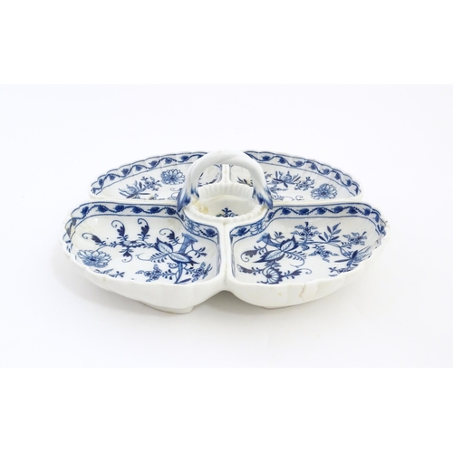 16 - A Continental blue and white hors d'oeuvre dish decorated in the Onion pattern with four sections an... 