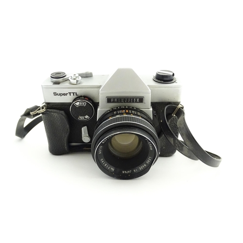 53 - A Prinzflex Super TTL camera with 55 mm f1.7 lens M42 screw mount together with a Rollei E 15B Elect... 