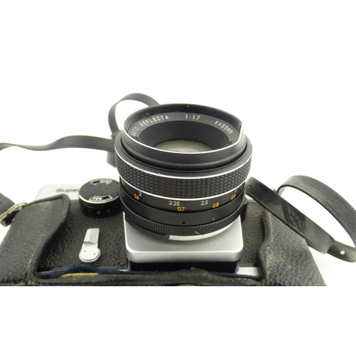 53 - A Prinzflex Super TTL camera with 55 mm f1.7 lens M42 screw mount together with a Rollei E 15B Elect... 