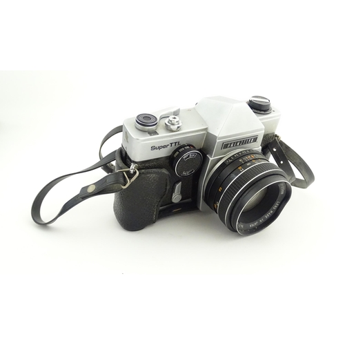 53 - A Prinzflex Super TTL camera with 55 mm f1.7 lens M42 screw mount together with a Rollei E 15B Elect... 