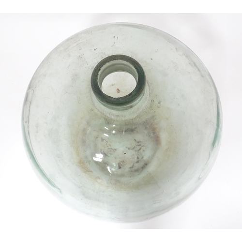 65 - A large glass carboy / demijohn bottle, approx 20