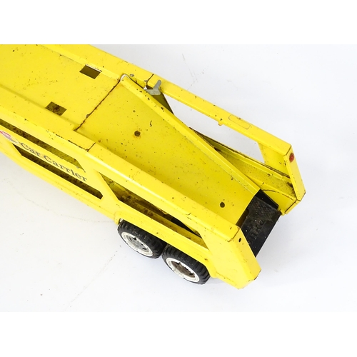 70 - Toys: A quantity of Tonka Toys construction vehicles to include a yellow Car Carrier, Claw Crane, a ... 