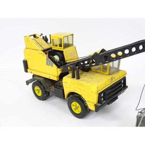 70 - Toys: A quantity of Tonka Toys construction vehicles to include a yellow Car Carrier, Claw Crane, a ... 