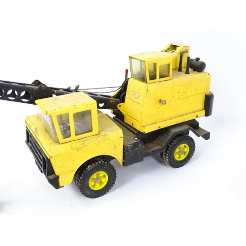 70 - Toys: A quantity of Tonka Toys construction vehicles to include a yellow Car Carrier, Claw Crane, a ... 