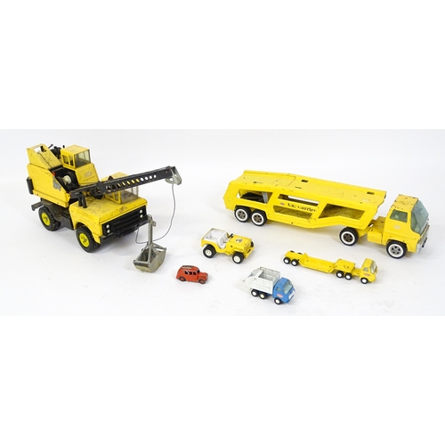 70 - Toys: A quantity of Tonka Toys construction vehicles to include a yellow Car Carrier, Claw Crane, a ... 