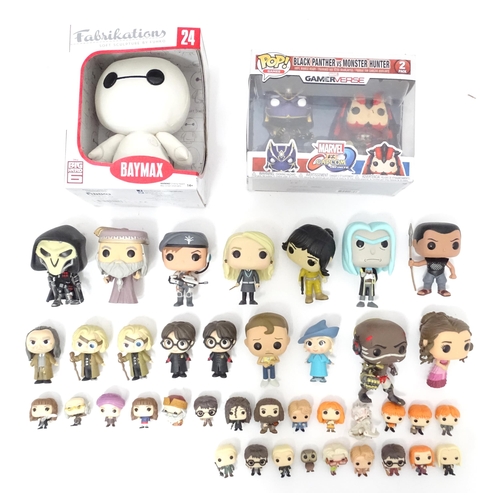 74 - Collectors toys : A quantity of Funko POP! toys to include a boxed Baymax, a boxed Black Panther vs ... 