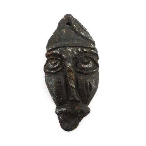 78 - Ethnographic / Native / Tribal : Three African carved soapstone amulets / talisman of mask form. Lar... 