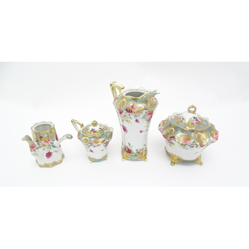 86 - Four Noritake wares decorated with flowers and foliage with gilt detail to include a chocolate pot, ... 