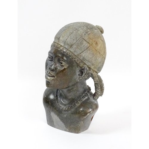 103 - Ethnographic / Native / Tribal : An African carved soapstone bust modelled as a woman wearing a bonn... 