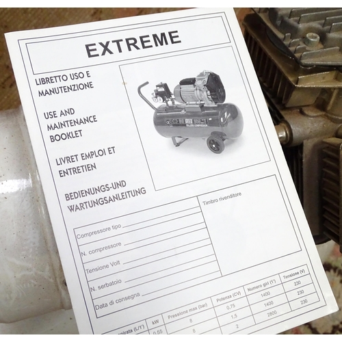 833 - Workshop Tools : an Axminster / Nardi compressor on wheeled base, with pneumatic hose and manual. Ap... 