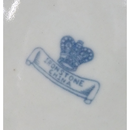 23 - A pair of blue and white biscuit barrels with silver plate lids. Approx. 8 1/2