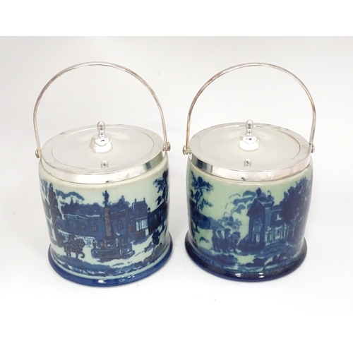 23 - A pair of blue and white biscuit barrels with silver plate lids. Approx. 8 1/2