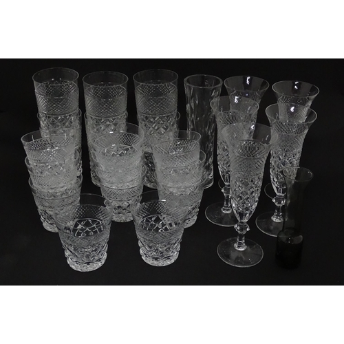 796 - A quantity of assorted glassware to including various drinking glasses, Champagne flutes etc. Flutes... 