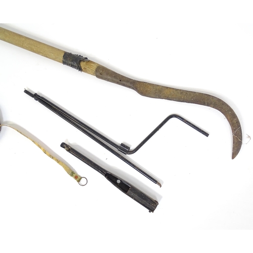 828 - A mid 20thC hedgelaying slasher with scythe blade, together with a car jack and a leather cased tape... 