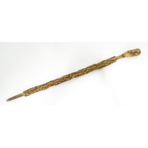 842 - A 20thC cork walking stick. Approx. 35