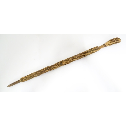 842 - A 20thC cork walking stick. Approx. 35