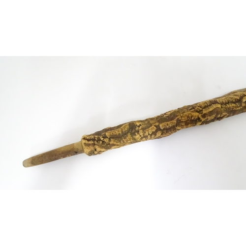 842 - A 20thC cork walking stick. Approx. 35