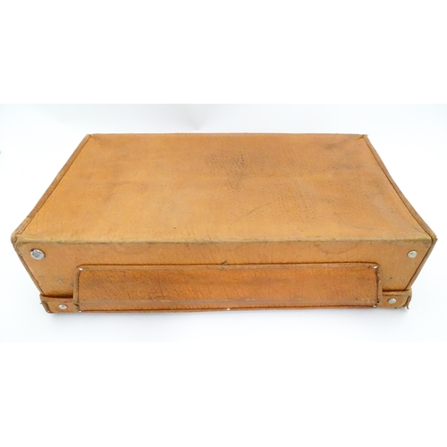 63 - An mid 20thC ' Stoawa ' folding leather suitcase, the lined interior with collapsing boards and with... 