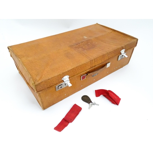 63 - An mid 20thC ' Stoawa ' folding leather suitcase, the lined interior with collapsing boards and with... 