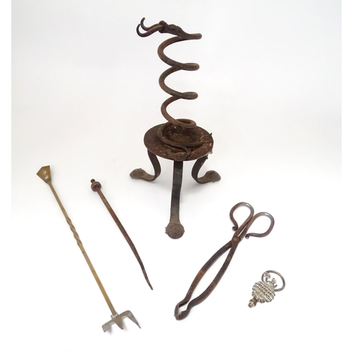 795 - A wrought iron fire tool set, comprising tongs, poker and stand, together with a brass toasting fork... 