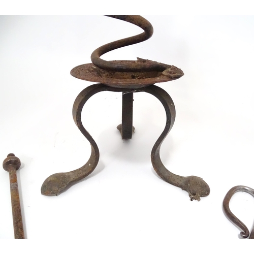 795 - A wrought iron fire tool set, comprising tongs, poker and stand, together with a brass toasting fork... 