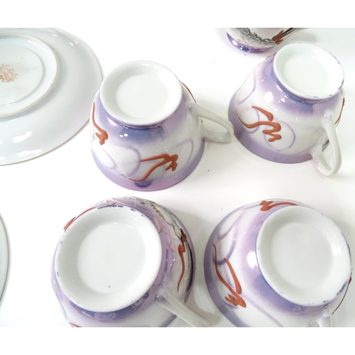 815 - A quantity of Oriental tea wares with dragon decoration to include teapot, sugar bowl, milk jug, cup... 