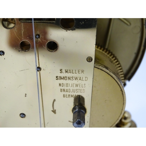 82 - A late 20thC anniversary / torsion clock by Haller. Approx. 11 3/4