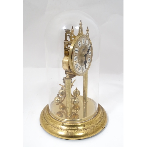 82 - A late 20thC anniversary / torsion clock by Haller. Approx. 11 3/4