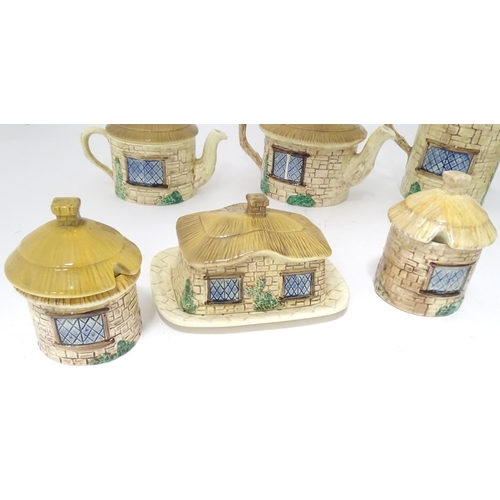 839 - A quantity of Sylvac cottage wares to include teapot, hot water pot, butter dish, sugar pot, cruet s... 