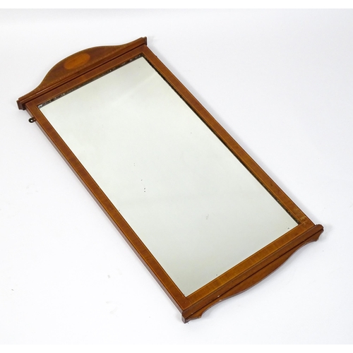 13 - An early 20thC mahogany wall mirror with satinwood marquetry decoration. 19