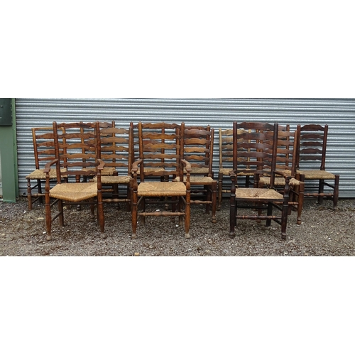 15 - Thirteen assorted 19thC ash and rush seated ladderback dining chairs, to include three carvers, the ... 