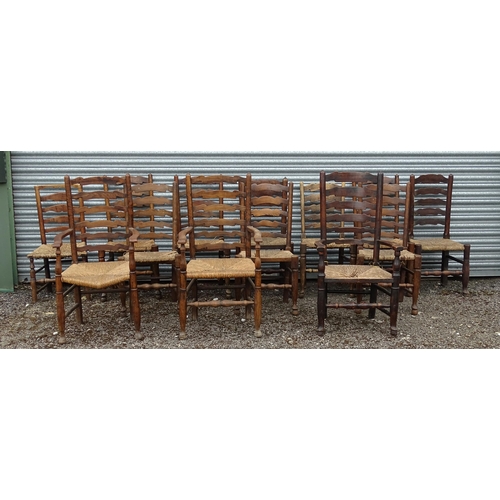 15 - Thirteen assorted 19thC ash and rush seated ladderback dining chairs, to include three carvers, the ... 