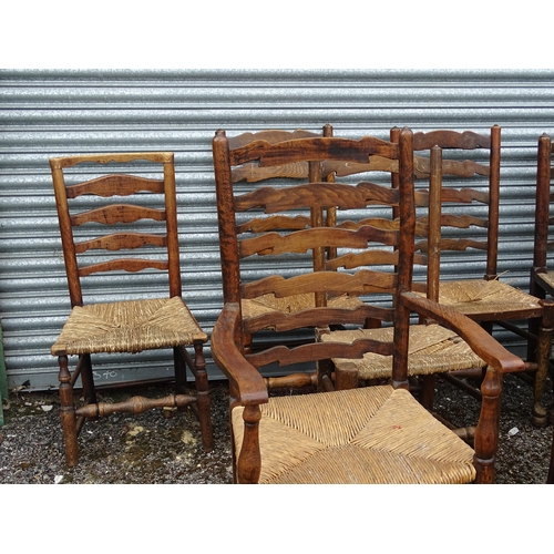 15 - Thirteen assorted 19thC ash and rush seated ladderback dining chairs, to include three carvers, the ... 