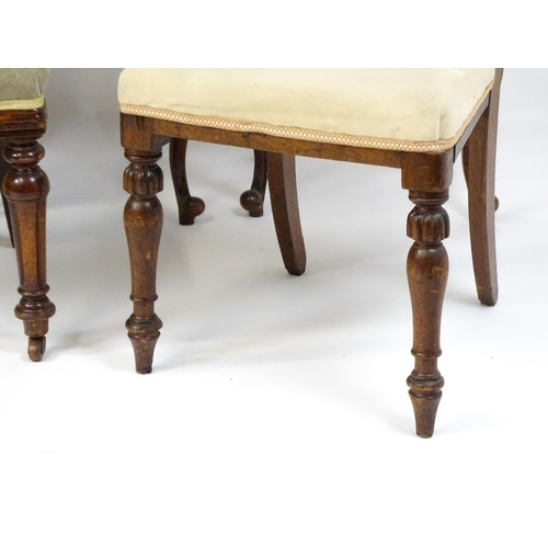 33 - A group of seven chairs to include four mahogany balloon backs, a deep buttoned side chair and two 1... 