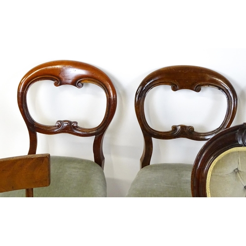 33 - A group of seven chairs to include four mahogany balloon backs, a deep buttoned side chair and two 1... 