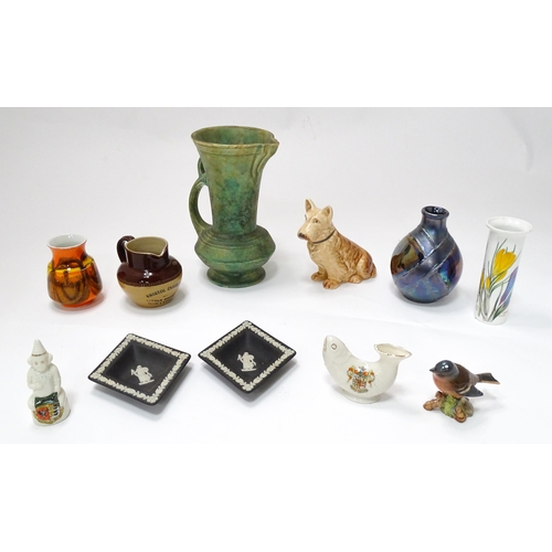 61 - A quantity of assorted ceramic wares to include a Beswick model of a Chaffinch, Poole pottery vases,... 